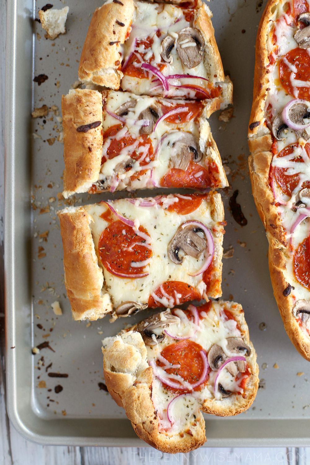 The BEST French Bread Pizza - so easy and delicious! Takes less than 30 mins to prepare. Perfect for busy school nights!